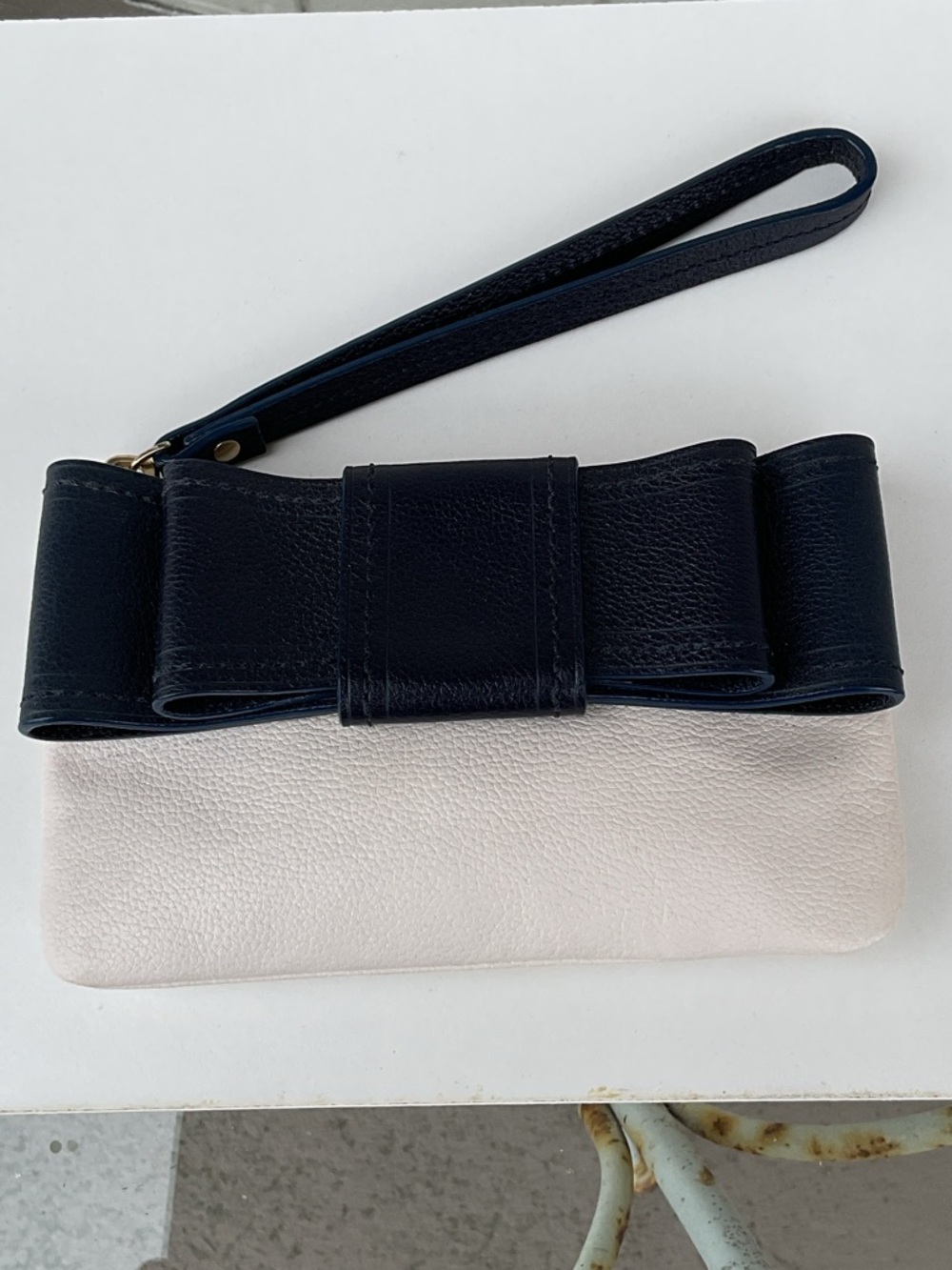kate spade Cream Wristlet with Navy Bow